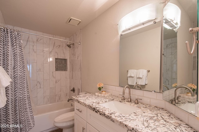 bathroom with vanity, shower / bathtub combination with curtain, and toilet