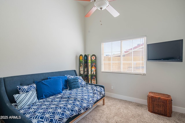 carpeted bedroom with baseboards and ceiling fan