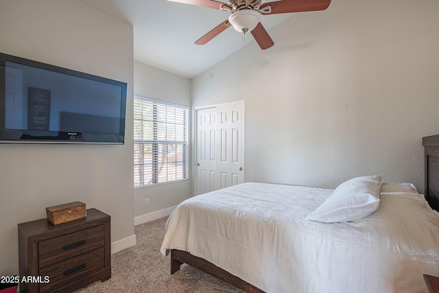 bedroom with a closet, baseboards, carpet flooring, high vaulted ceiling, and ceiling fan