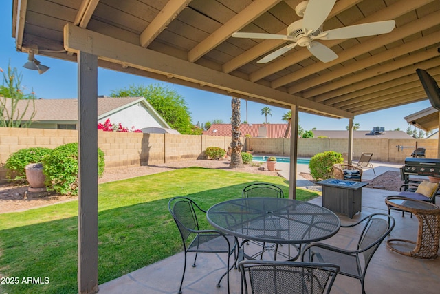 view of patio / terrace featuring a fenced in pool, area for grilling, a fenced backyard, ceiling fan, and outdoor dining area