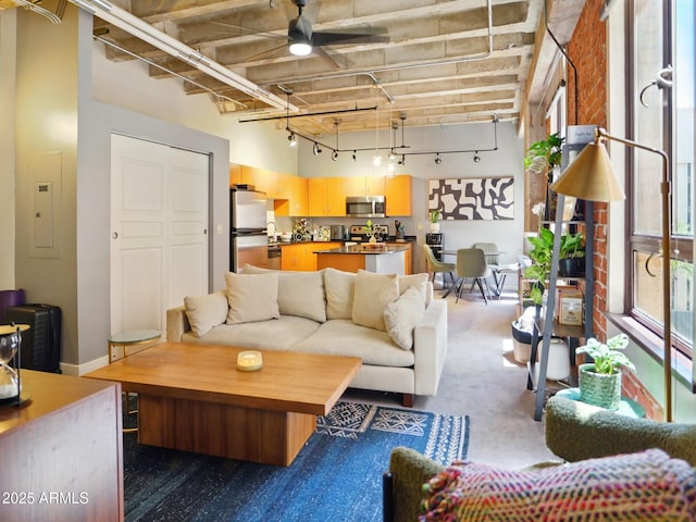 114 W Adams St Unit 505, Phoenix, AZ 85003 - carpeted living area featuring a high ceiling, electric panel, ceiling fan, and track lighting