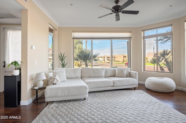 sunroom with a ceiling fan and visible vents