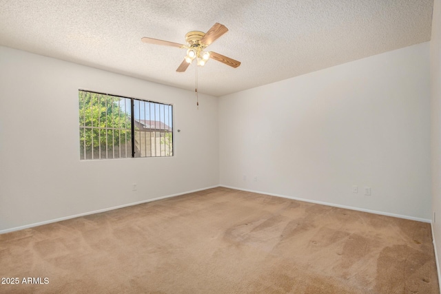 6602 W Ironwood Dr, Glendale, AZ 85302 - spare room featuring light colored carpet, a ceiling fan, a textured ceiling, and baseboards
