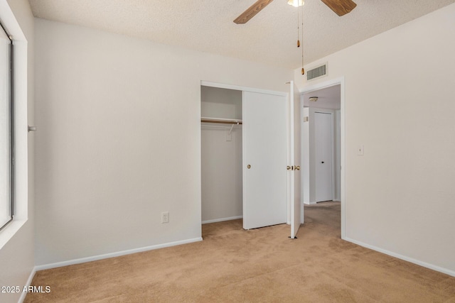 6602 W Ironwood Dr, Glendale, AZ 85302 - unfurnished bedroom with light carpet, a closet, baseboards, a textured ceiling, and ceiling fan