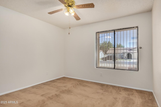 6602 W Ironwood Dr, Glendale, AZ 85302 - carpeted empty room with baseboards, ceiling fan, and a textured ceiling