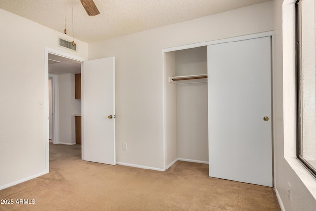 6602 W Ironwood Dr, Glendale, AZ 85302 - unfurnished bedroom with carpet, a closet, baseboards, a ceiling fan, and a textured ceiling