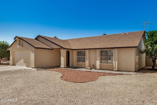 6602 W Ironwood Dr, Glendale, AZ 85302 - single story home featuring an attached garage, stucco siding, a shingled roof, and concrete driveway