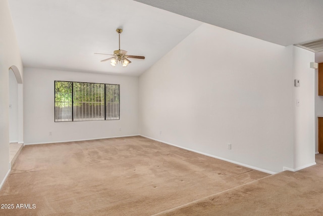 6602 W Ironwood Dr, Glendale, AZ 85302 - spare room featuring ceiling fan, light carpet, baseboards, and lofted ceiling