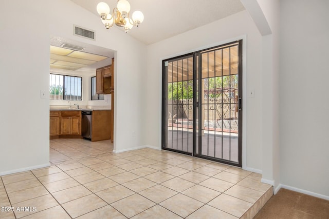 6602 W Ironwood Dr, Glendale, AZ 85302 - unfurnished dining area with a chandelier, a sink, baseboards, light tile patterned floors, and vaulted ceiling