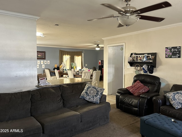 carpeted living room with ornamental molding and ceiling fan