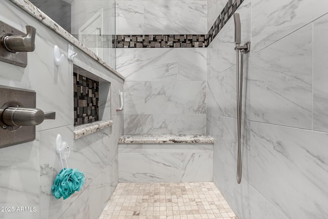 full bathroom featuring a marble finish shower