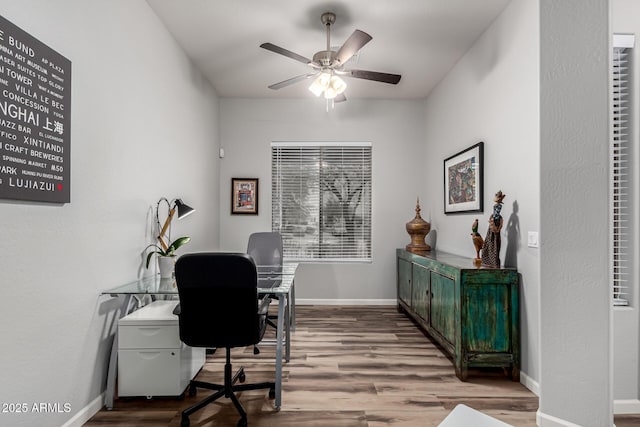 office with ceiling fan, baseboards, and wood finished floors