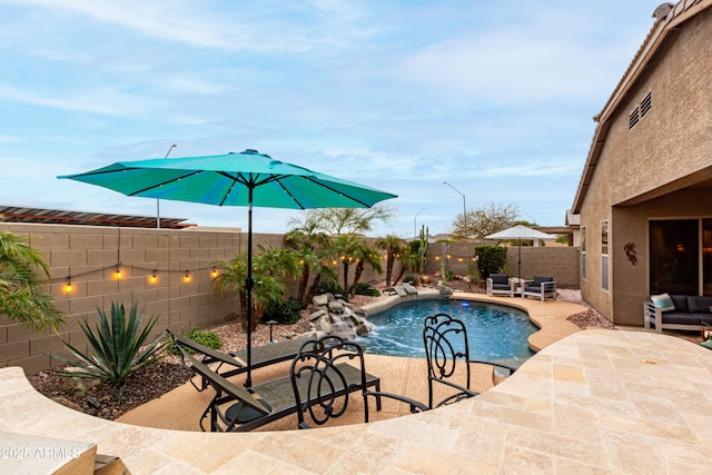 view of pool featuring a patio area, a fenced backyard, and a fenced in pool