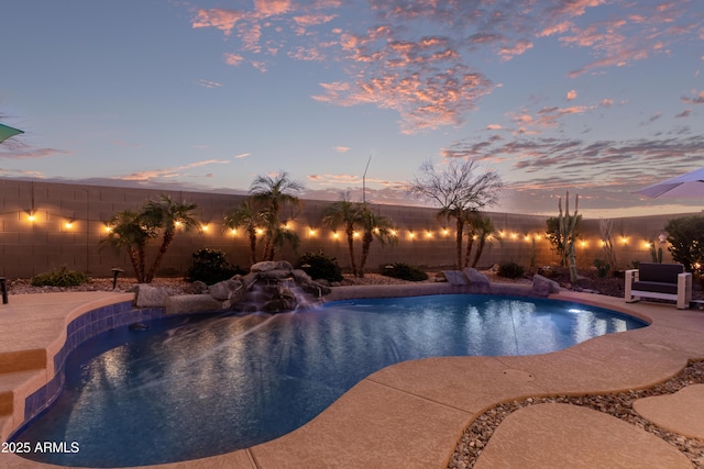 view of swimming pool featuring a fenced in pool and a fenced backyard