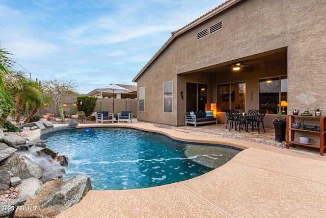 view of pool featuring a fenced in pool, a patio, an outdoor hangout area, ceiling fan, and fence