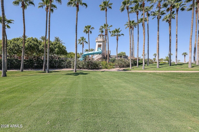 view of community featuring a yard