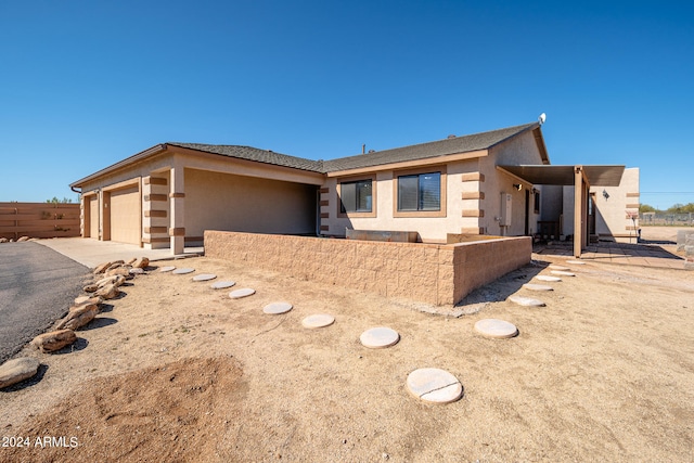 single story home with a garage