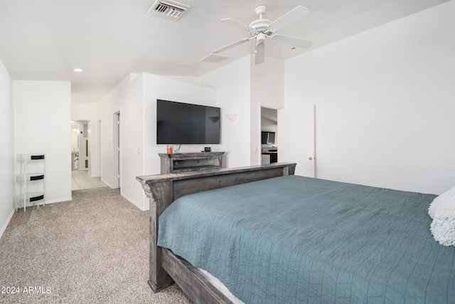 carpeted bedroom featuring lofted ceiling and ceiling fan