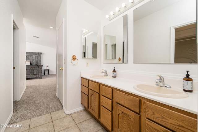 bathroom with vanity and tile patterned flooring