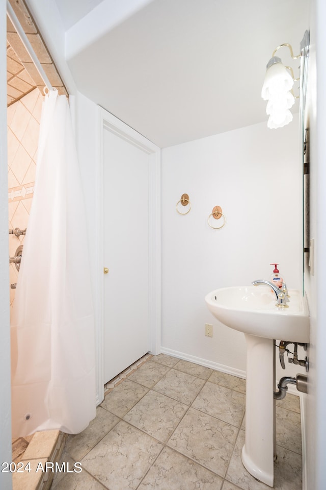 bathroom with a shower with shower curtain