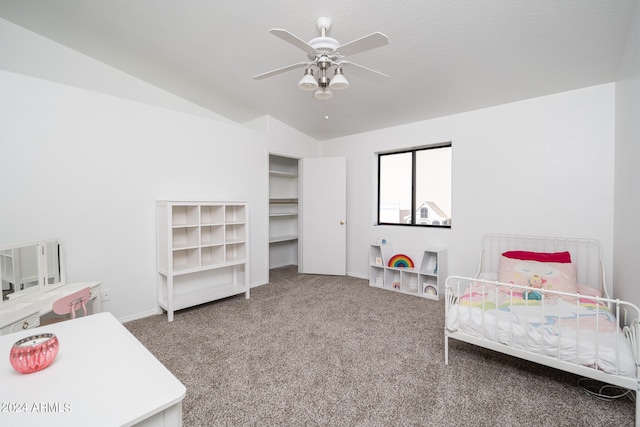 bedroom featuring carpet floors, vaulted ceiling, and ceiling fan