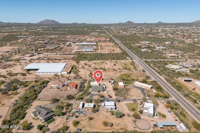 birds eye view of property featuring a mountain view