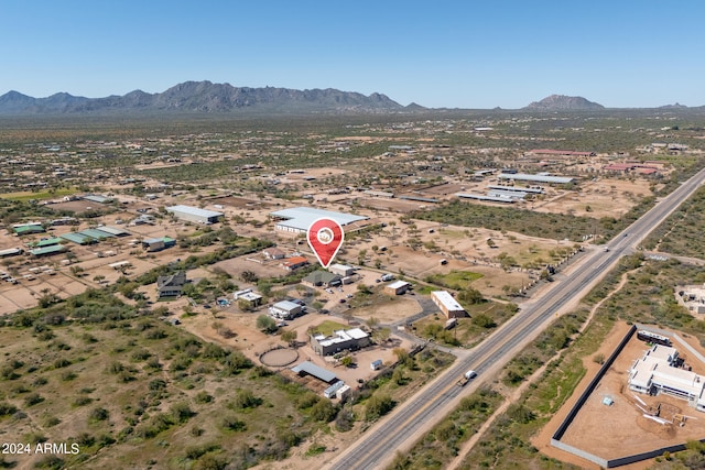 birds eye view of property featuring a mountain view