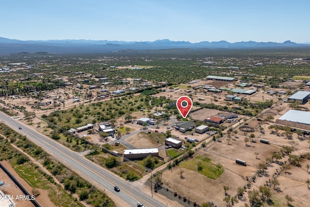 birds eye view of property featuring a mountain view