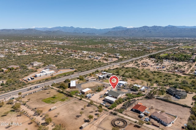 birds eye view of property featuring a mountain view