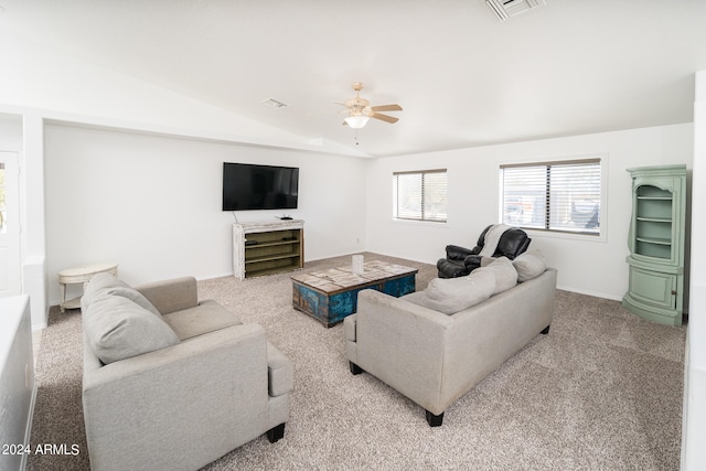 carpeted living room featuring ceiling fan and vaulted ceiling