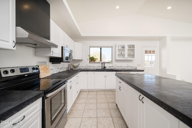 kitchen featuring plenty of natural light, wall chimney range hood, sink, white cabinetry, and stainless steel electric stove