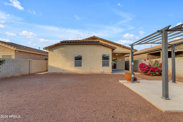 rear view of house featuring a patio