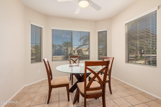 dining room featuring ceiling fan and light tile patterned floors