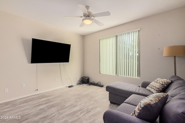 living room featuring light wood-type flooring and ceiling fan