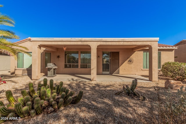 back of property featuring a patio