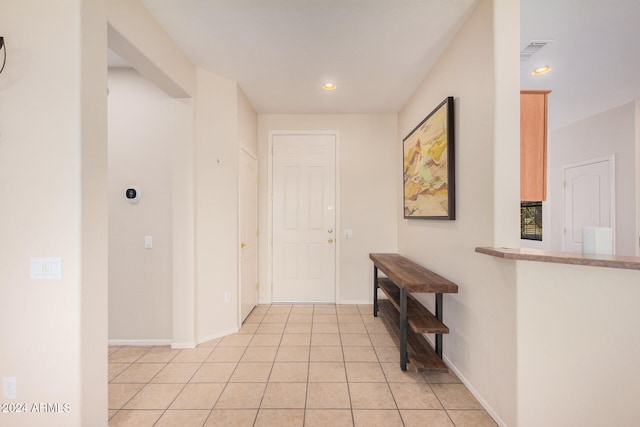 hallway featuring light tile patterned floors