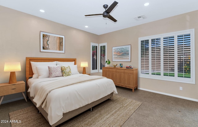 bedroom with carpet, ceiling fan, and multiple windows