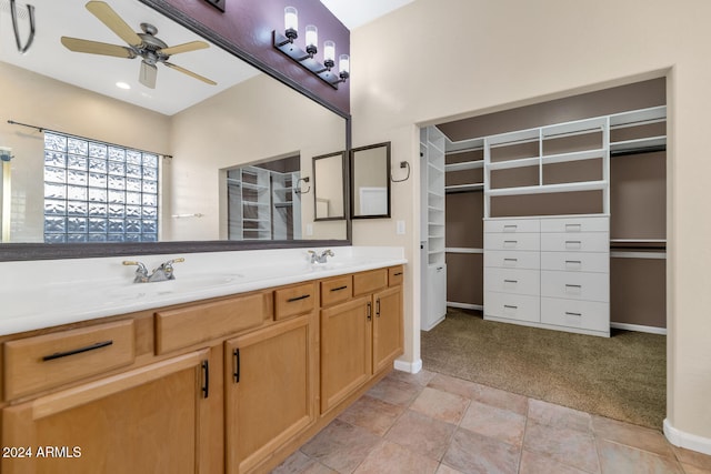 bathroom featuring ceiling fan and vanity