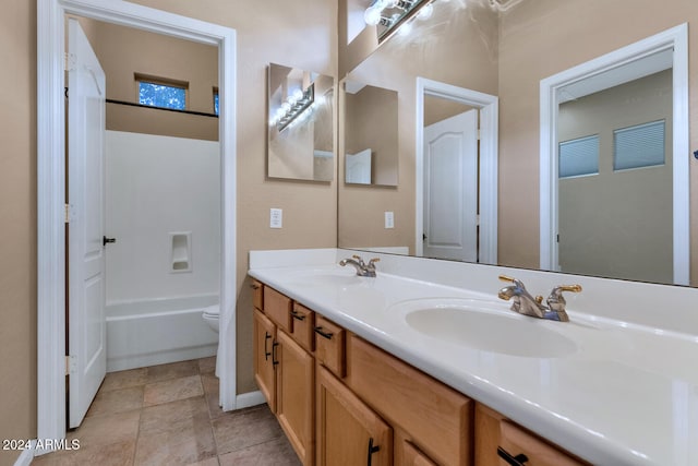 full bathroom with tile patterned flooring, vanity, bathing tub / shower combination, and toilet