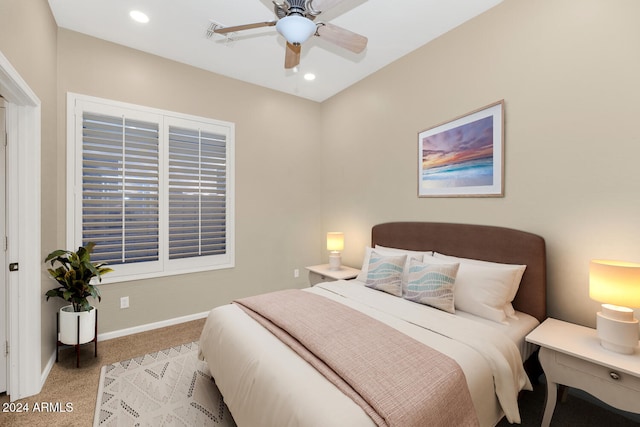 bedroom featuring ceiling fan and light colored carpet