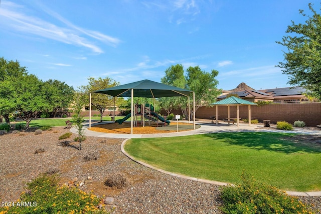 view of playground with a gazebo and a lawn