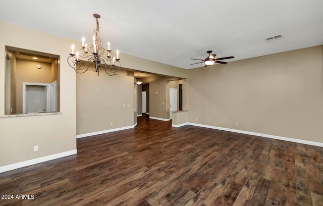 unfurnished living room featuring ceiling fan with notable chandelier and dark wood-type flooring