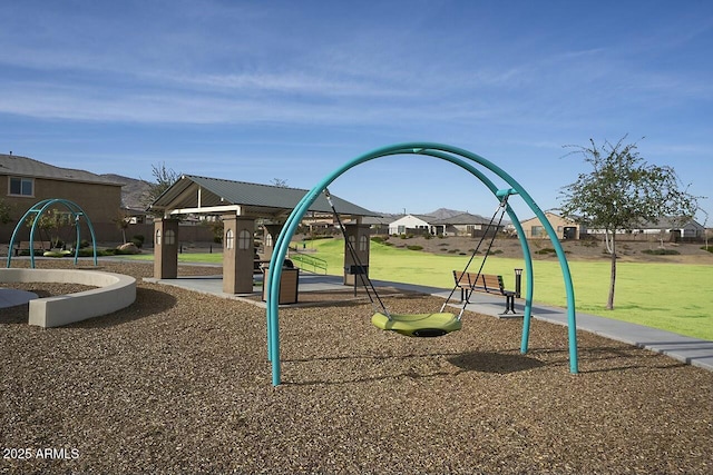 view of jungle gym featuring a lawn