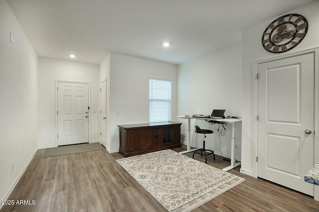 home office with wood-type flooring