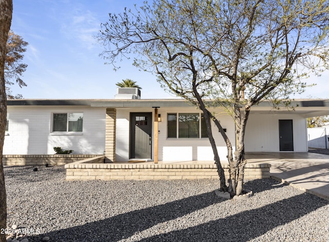 ranch-style home with a carport