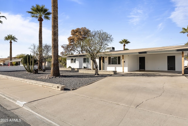 single story home with a carport