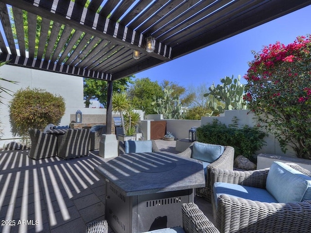 view of patio / terrace featuring a pergola and an outdoor hangout area