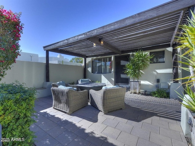 view of patio featuring an outdoor living space and a pergola