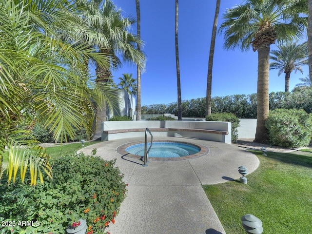 view of swimming pool featuring an in ground hot tub