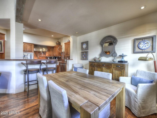 dining area featuring dark hardwood / wood-style floors